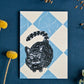 Postkarte „Katze auf Marmorboden“